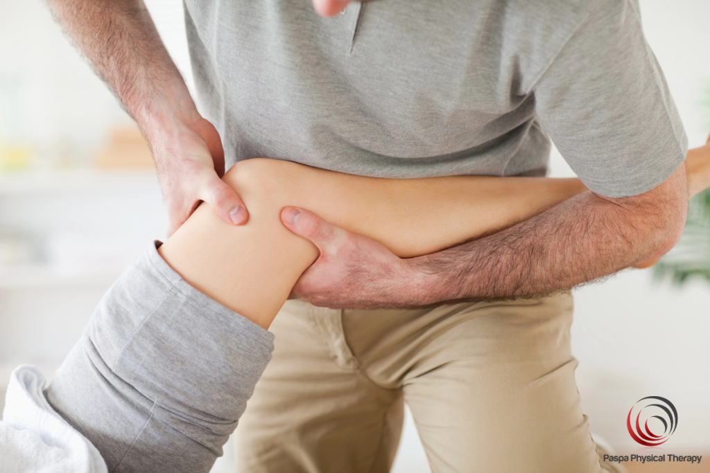 A physical therapist treating a patient recovering from a torn meniscus in Manhattan, New York.