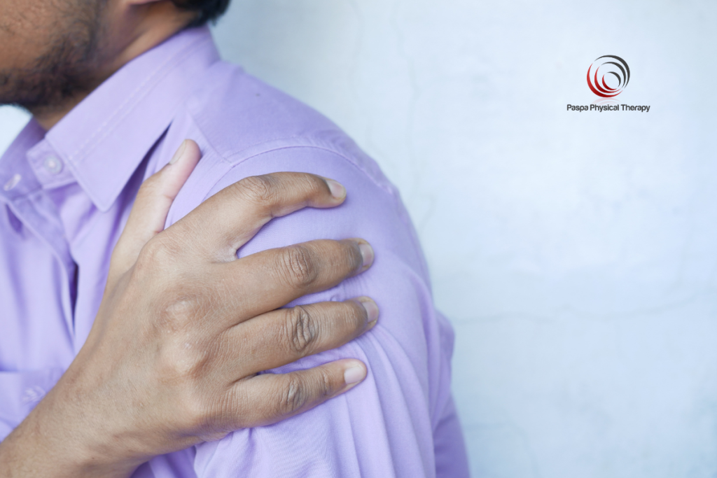 A man holding his frozen shoulder pain.