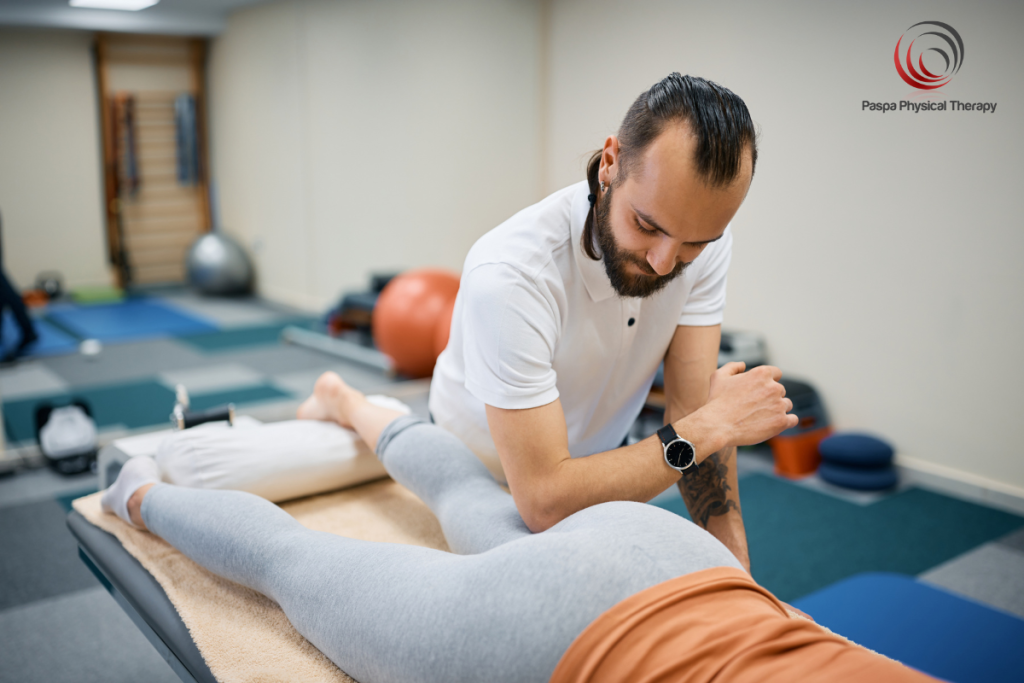 A physical therapist using manual therapy to treat a pulled hamstring in New York.
