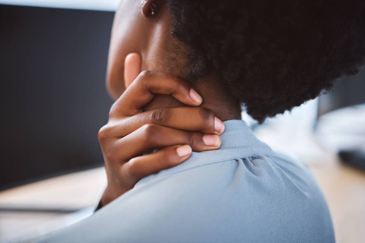 A woman experiencing tech neck.
